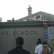 Green Grove Elementary School Prinicpal Reward Students By Reading On The Rooftop