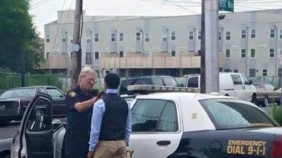 Photo Goes Viral of Jersey City Police Officer Showing a Teen How To Tie a Tie