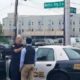Photo Goes Viral of Jersey City Police Officer Showing a Teen How To Tie a Tie